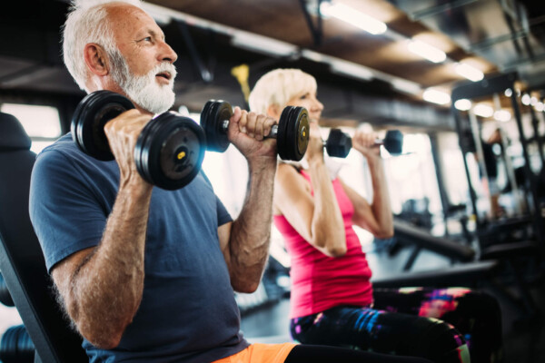 Older adults working out at gym