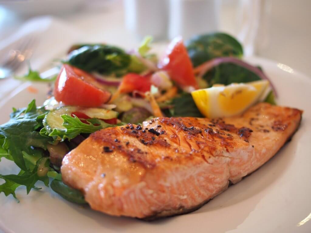Salmon and vegetables on a dinner plate