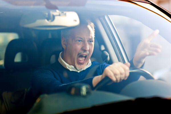 Angry, stressed driver having bad commute, road rage