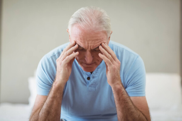 Stressed older man with gray hair