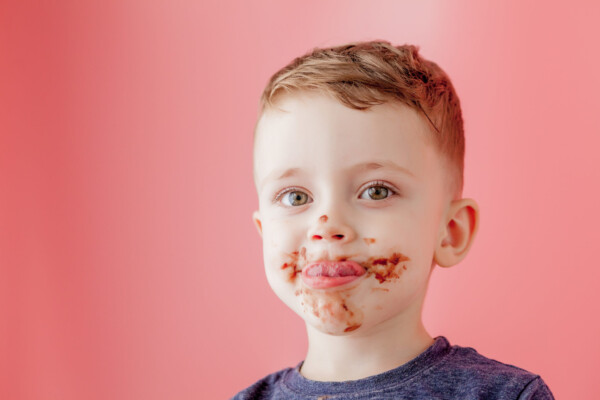 Child with chocolate on face
