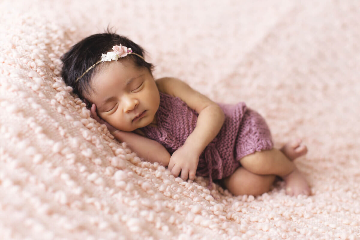 toddler-lying-on-pink-fleece-pad-1442005