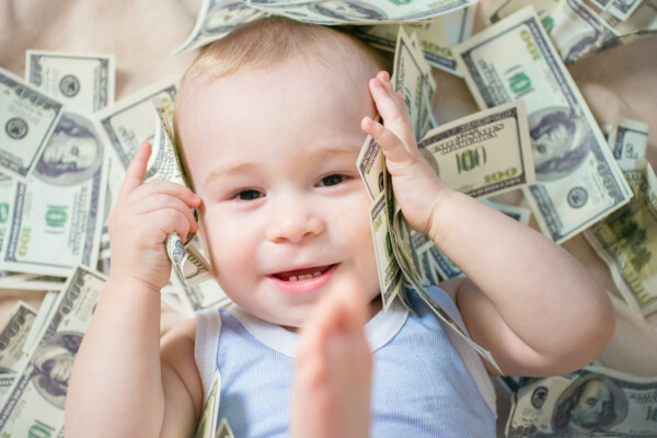 Baby laying in money