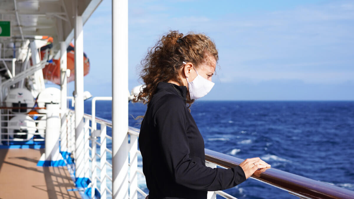 Woman wearing mask on cruise ship during coronavirus outbreak