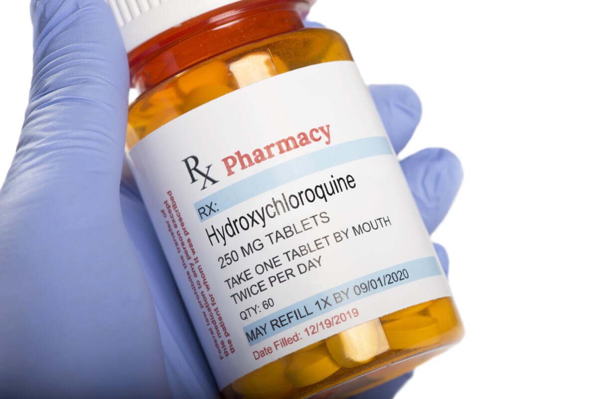 Generic Medication Hydroxychloroquine Prescription Bottle Held By Gloved Hand