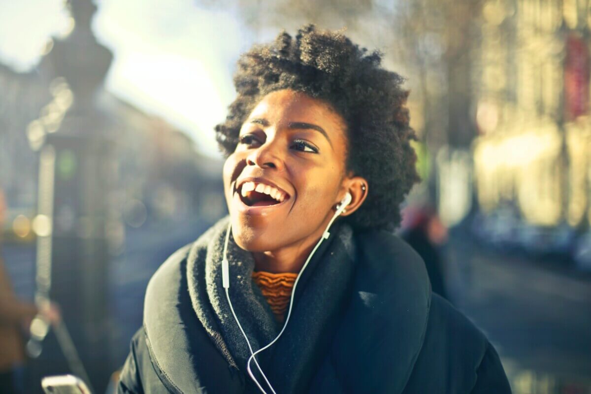 close-up-photo-of-a-woman-listening-to-music-813940