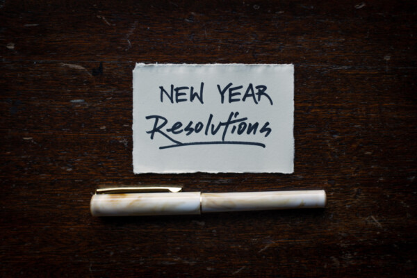New Year resolutions written on piece of paper