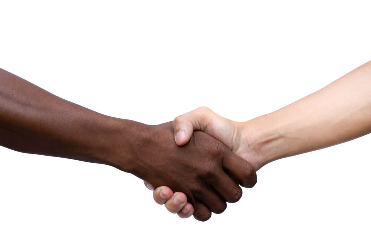 Black and White shaking hands isolated on white background