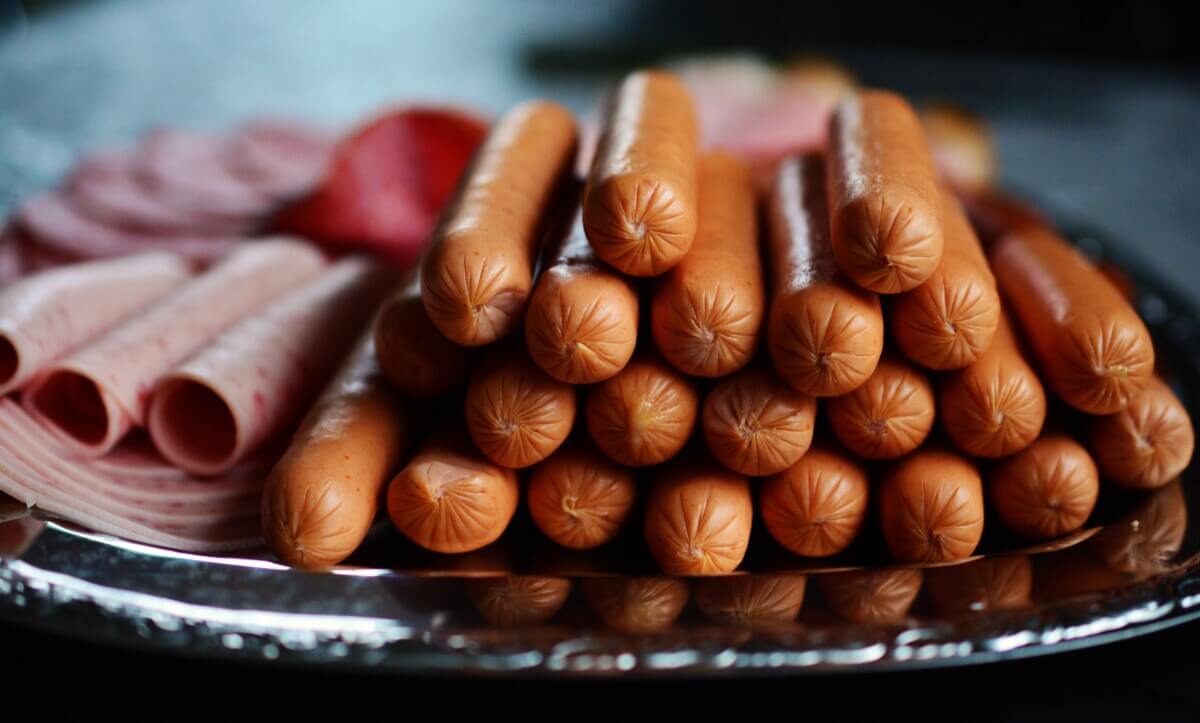 Hot dogs, processed meats on tray