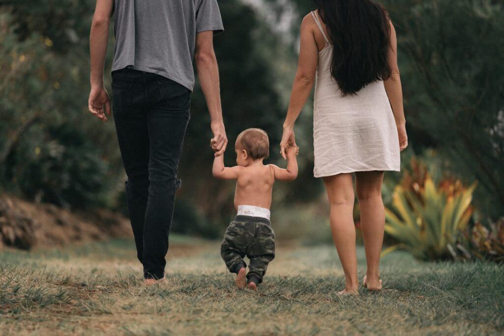 Couple walking with young child