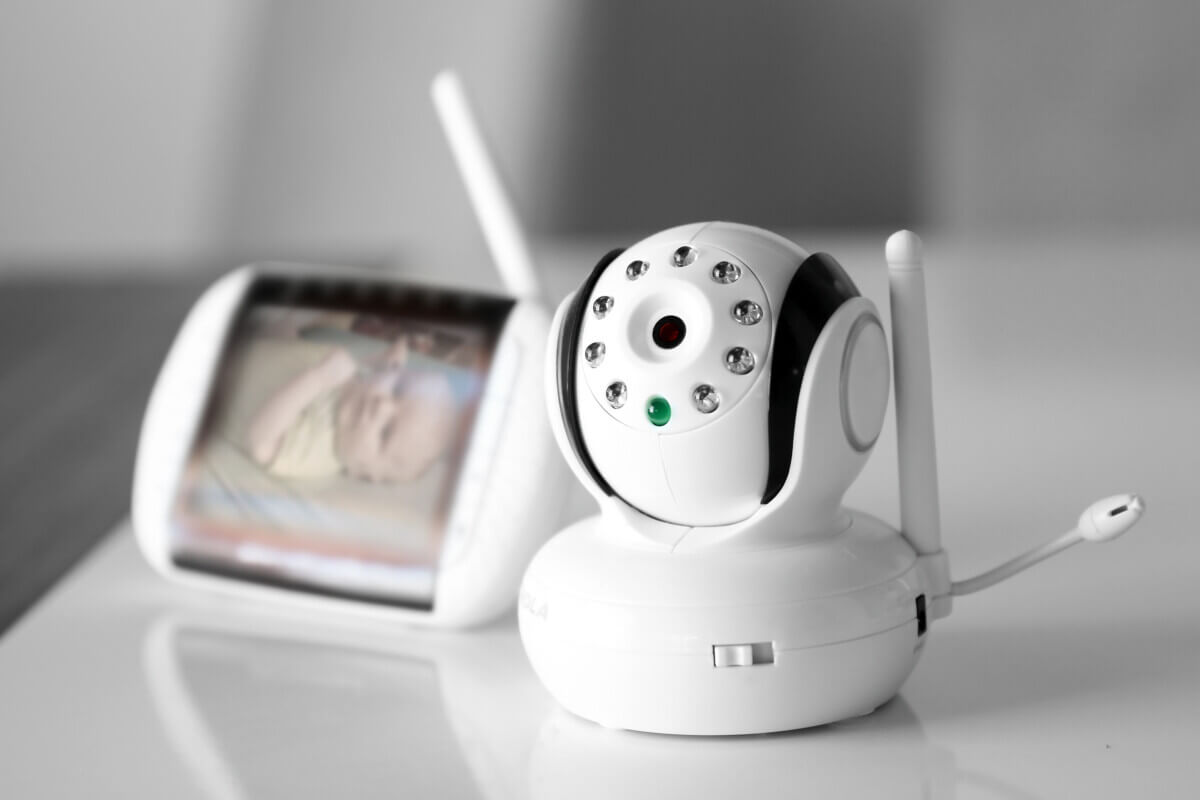 Baby monitor showing infant in crib