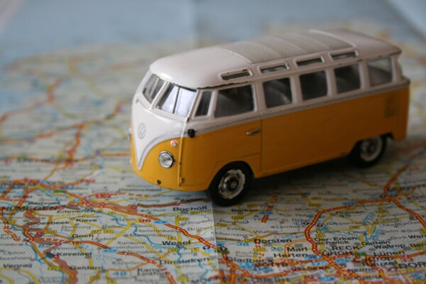 Volkswagen bus toy driving on map