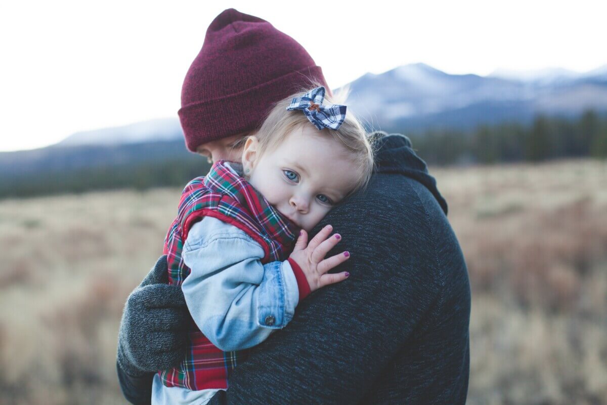 father hugging child