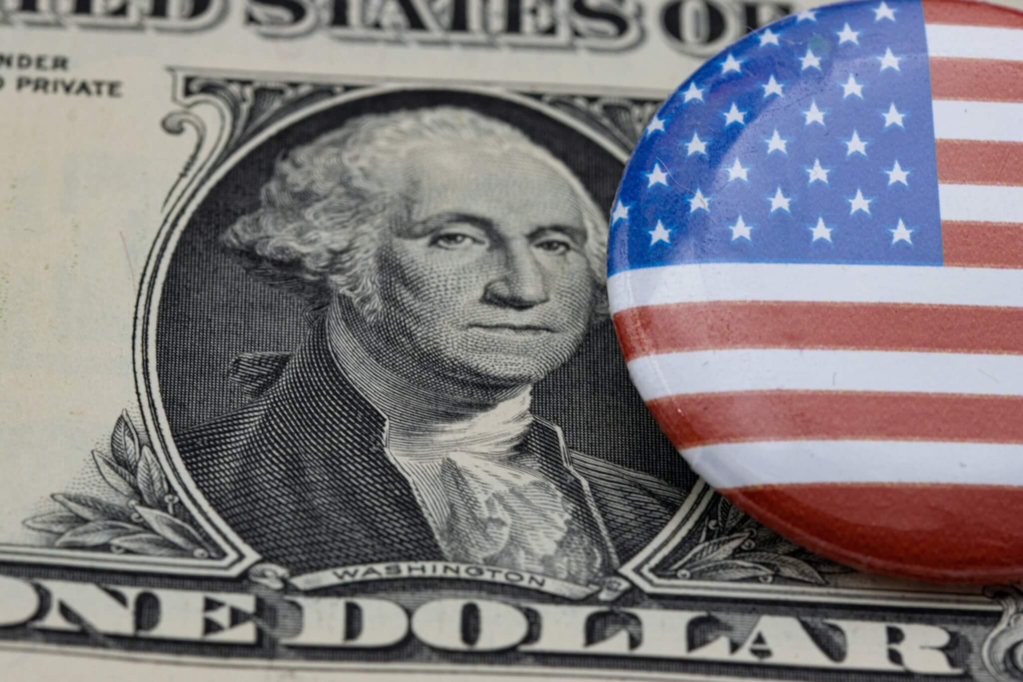 Dollar bill with George Washington and American Flag pin