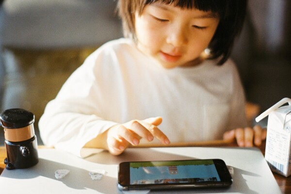 child playing on a phone