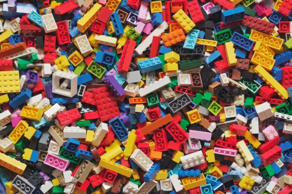 Legos of all shapes and sizes and colos in a pile