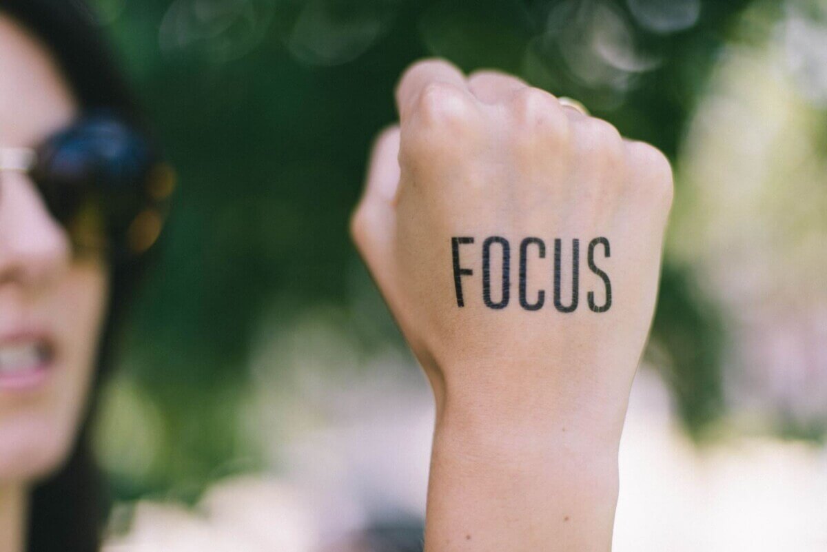 “Focus” written on a fist