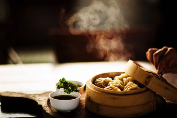 Chinese food dinner: Steamed Dim Sum dumplings on steamer