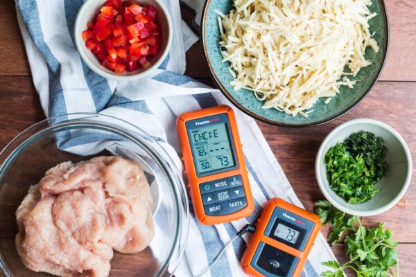 Meat thermometer on a counter with ingredients