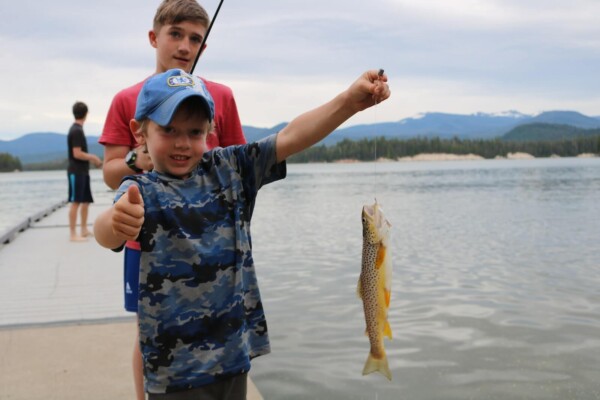 kids fishing at a lake