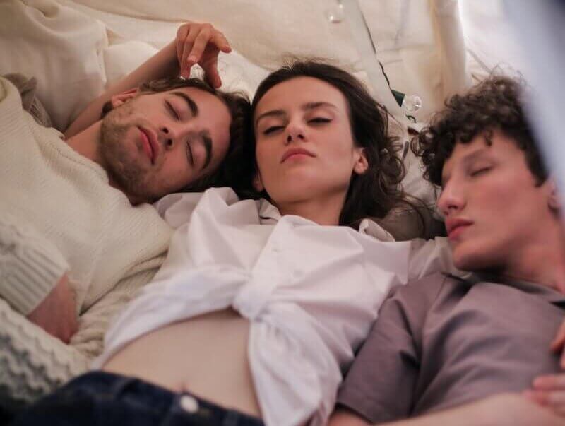 woman sleeping with 2 men