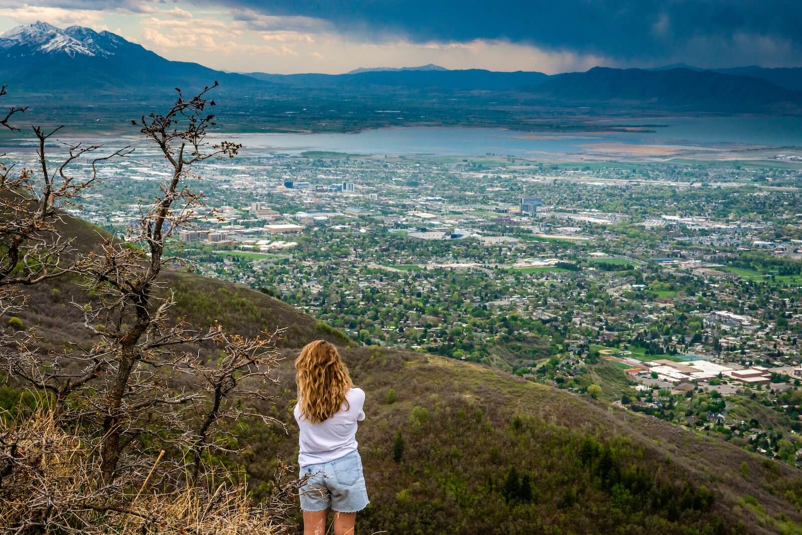 A woman overlooking Provo, Utah from high up