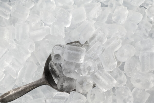 Ice scooper in ice cubes