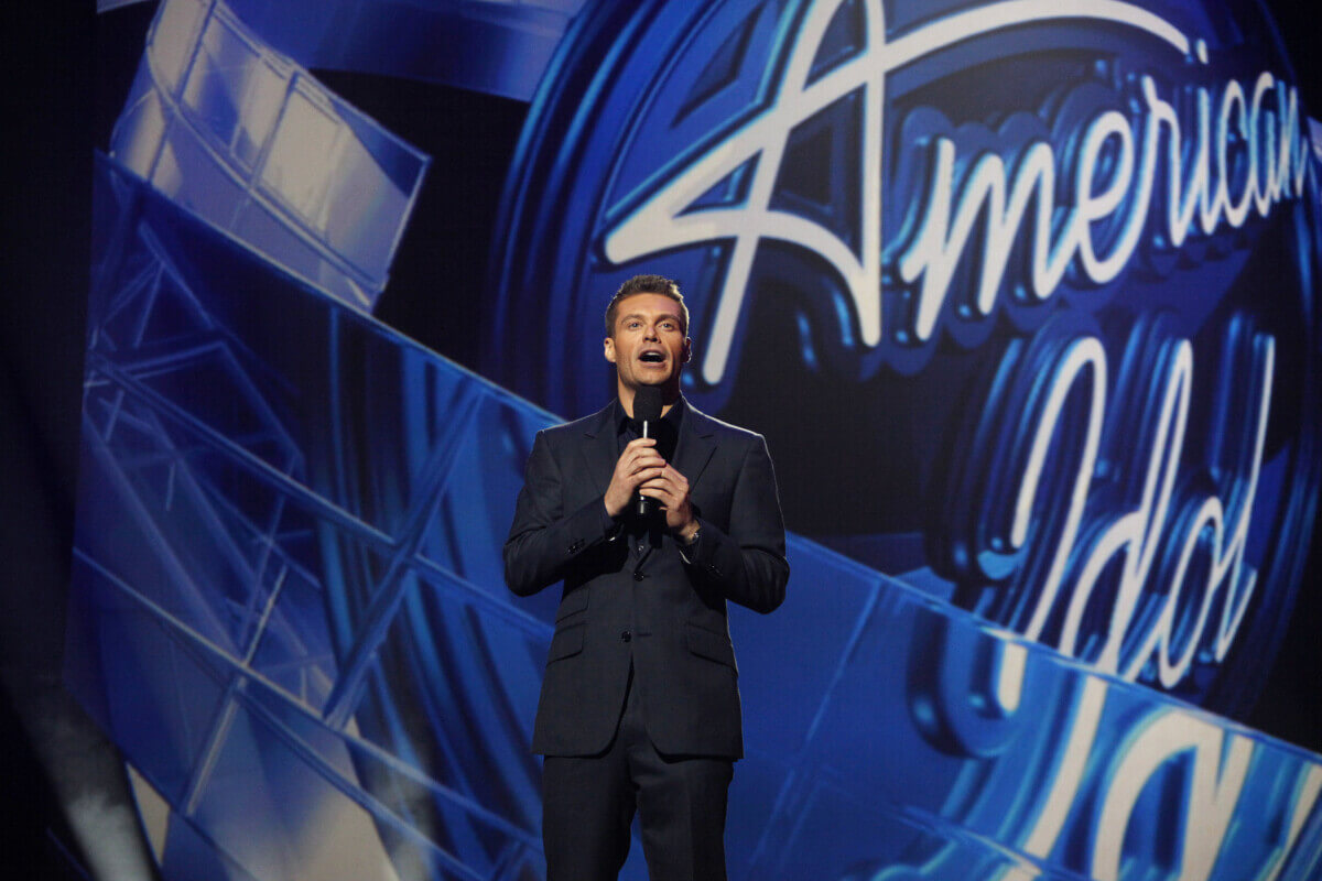 Ryan Seacrest hosting “American Idol”