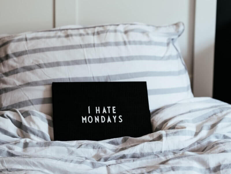 I hate Mondays sign on bed