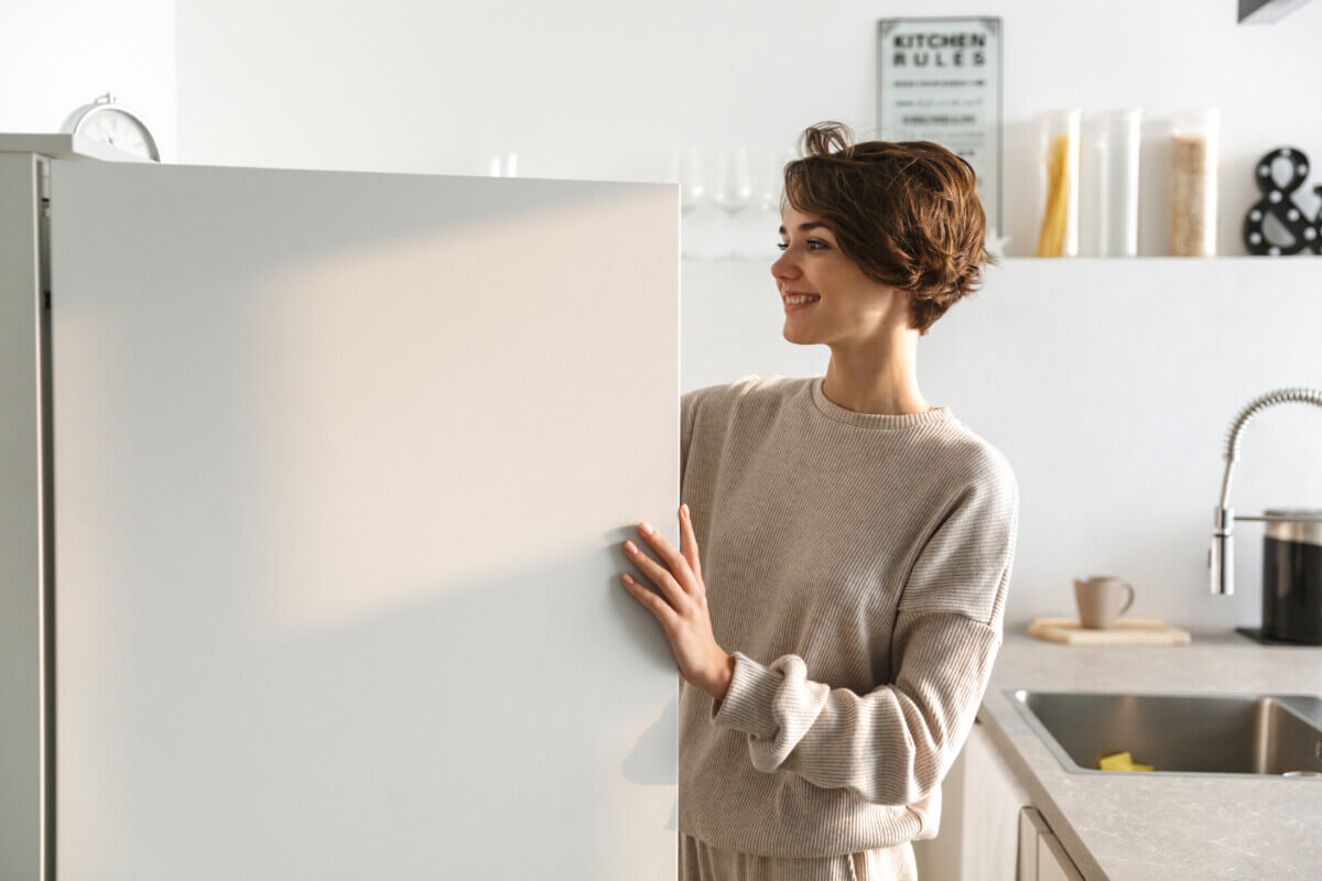 A woman looking in a refrigerator