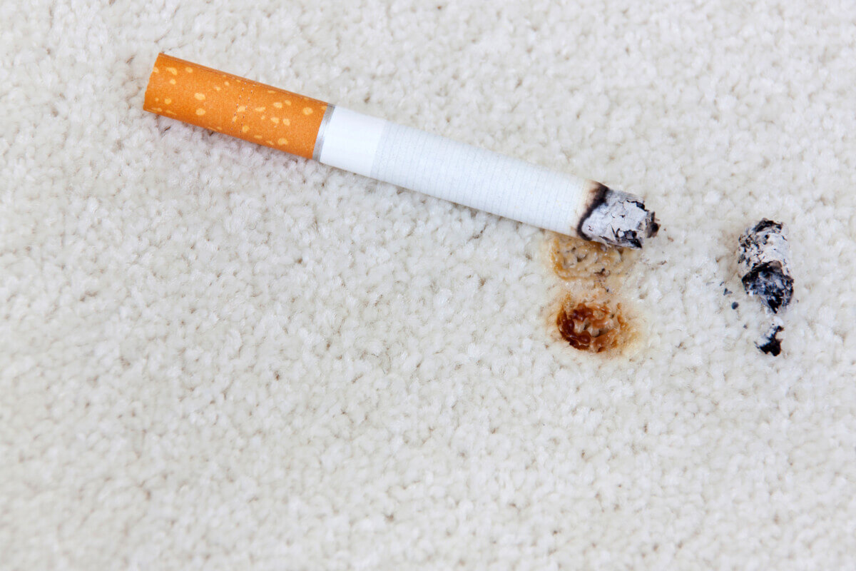 lit cigarette carpet