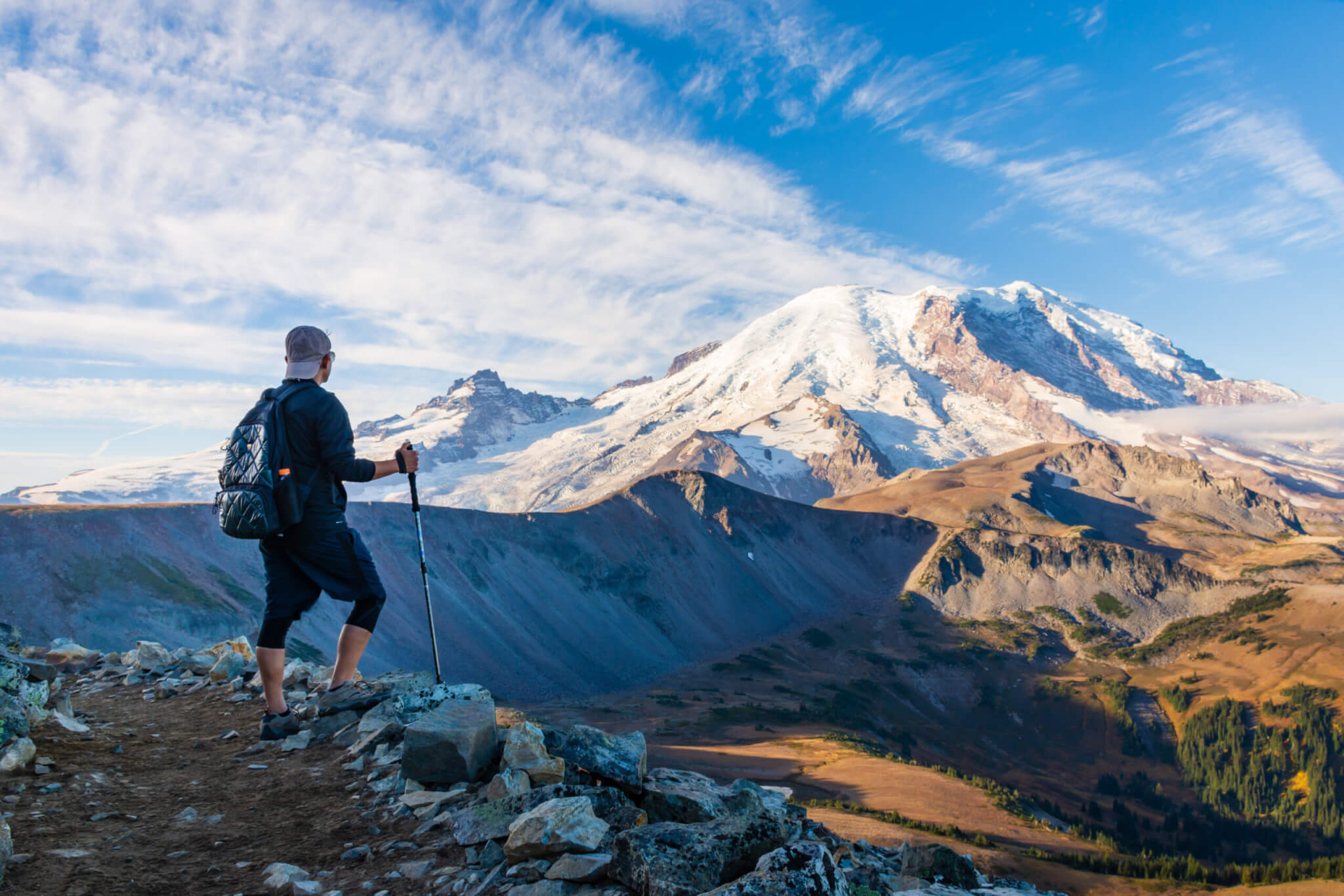 A hiker looking at Mount Rainier in Washington