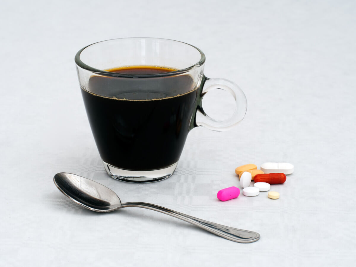 cup of coffee with pills