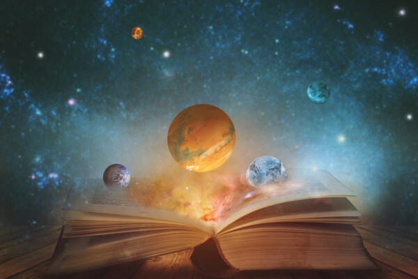 Planets and outer space flowing from a book