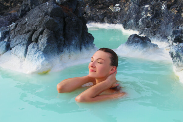 A woman in the Blue Lagoon hot springs in Iceland