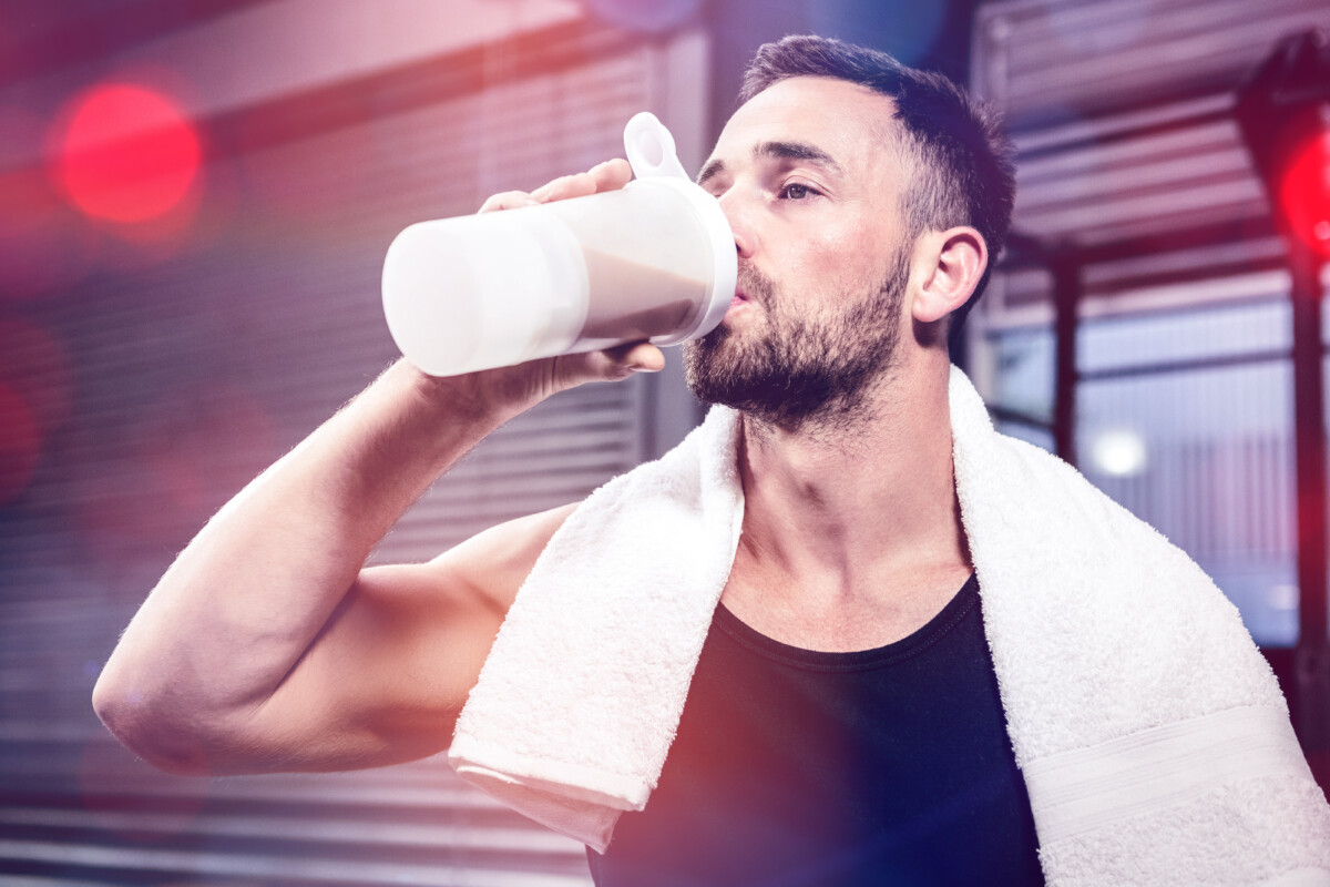 A man drinking a protein shake after a workout