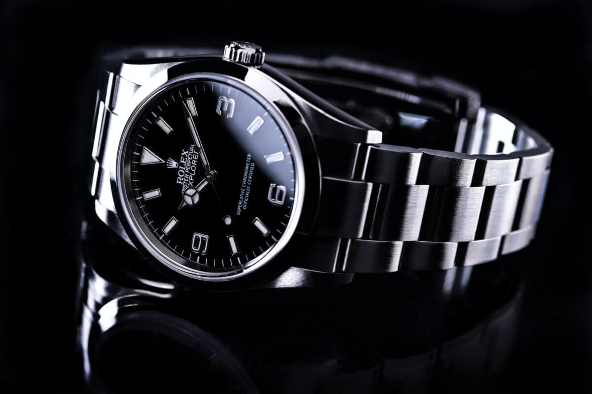 A black and silver Rolex watch