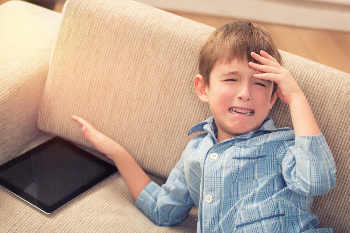 Boy crying about iPad