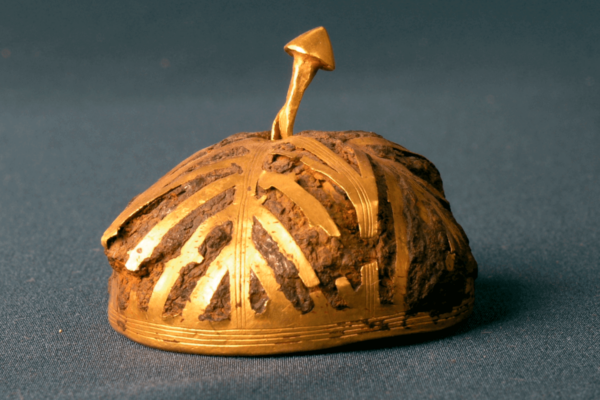 Hollow iron hemisphere covered with gold sheets.