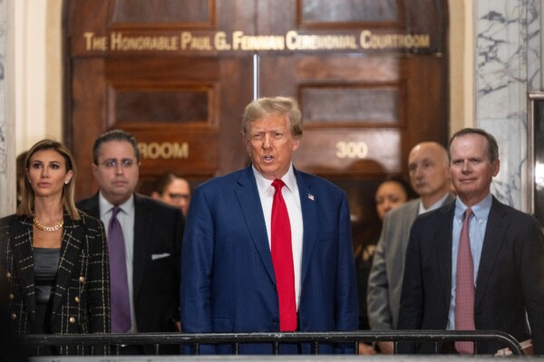 Former President Donald Trump speaks to the press before closing arguments at his civil fraud trial at State Supreme Court in New York on January 11, 2024.