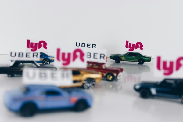 Rideshare vehicles: Cars with Uber and Lyft markers on them