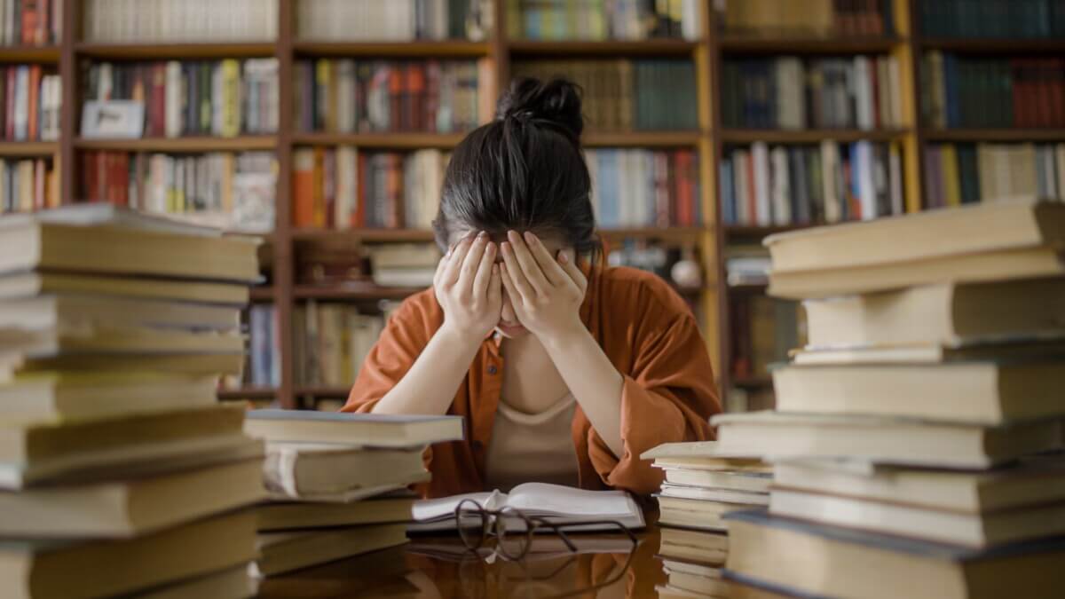 College Student Crying In Library