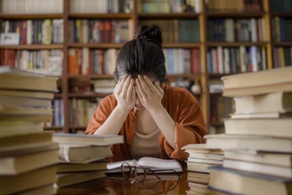 College Student Crying In Library
