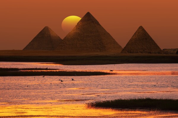 Giza Pyramids and Nile River at sunset