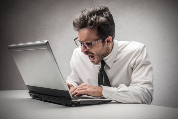 angry businessman writing an email