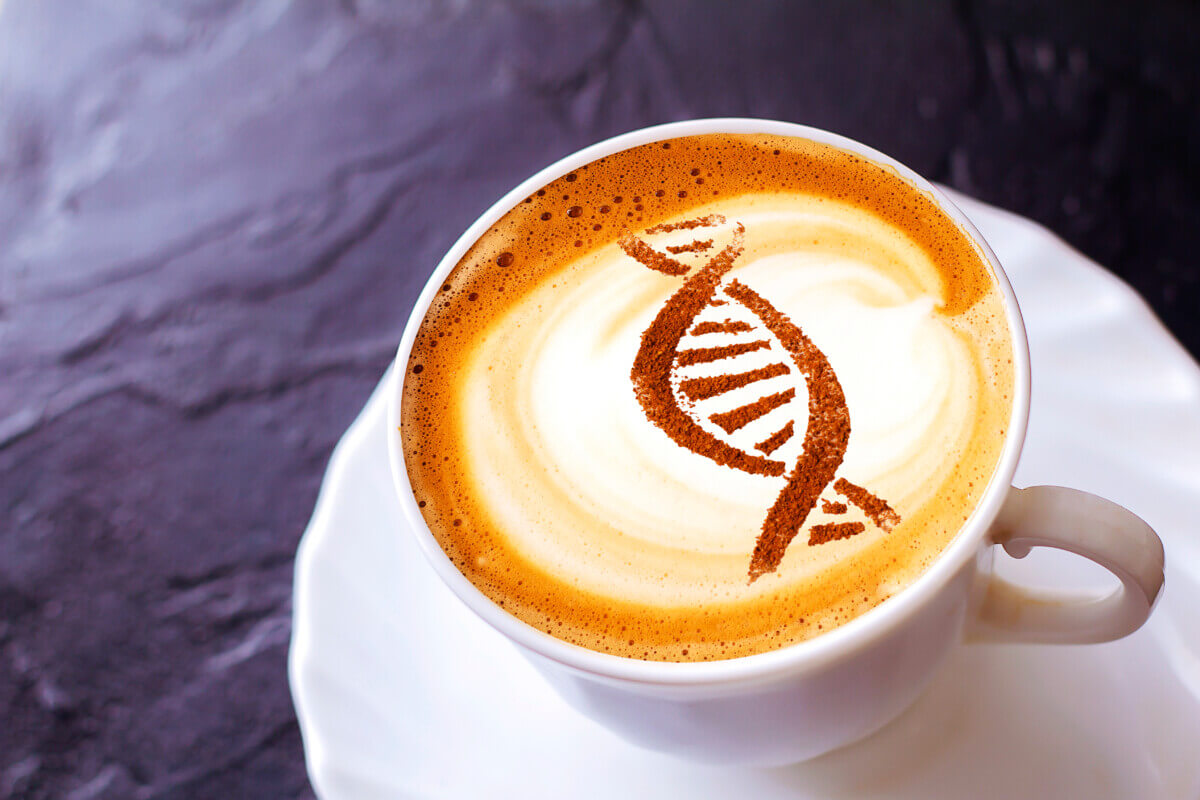 a cup of coffee with a picture of a chain of dna