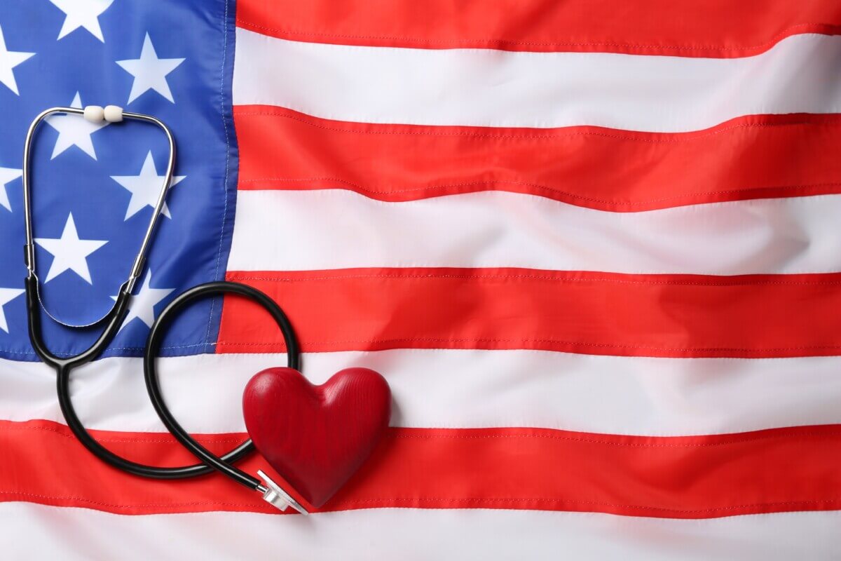 Stethoscope and red heart on American flag
